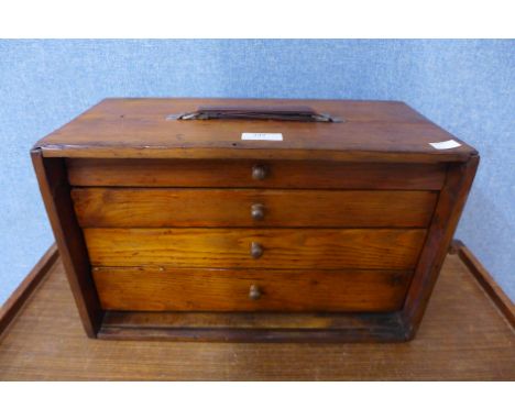 A pine engineer's chest with assorted tools 
