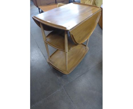 An Ercol Blonde elm and beech Windsor trolley 