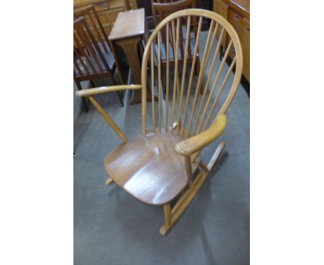 An Ercol Blonde elm and beech Windsor rocking chair 