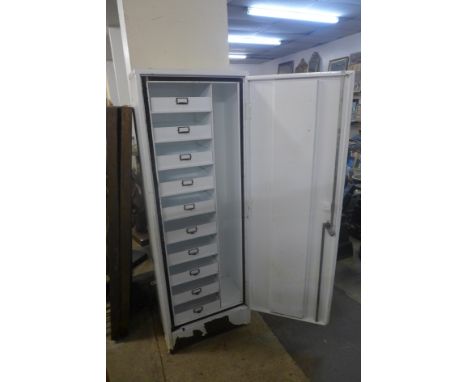 A painted metal fitted First Aid Post cabinet 