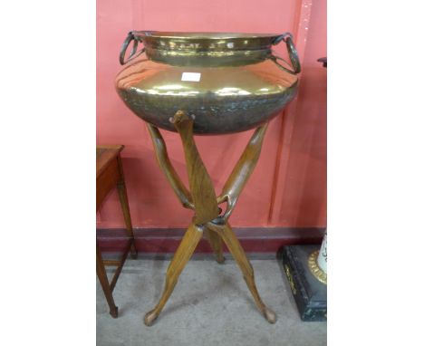 An African brass bowl on rootwood tripod stand