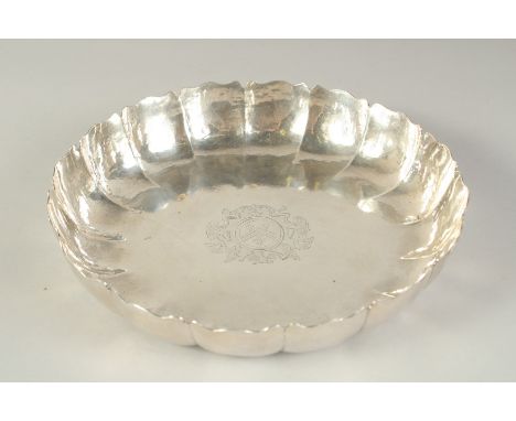 A GEORGE III SILVER STRAWBERRY DISH of typical lobed form, engraved to the centre with an armorial. Joseph Sander, London, 17