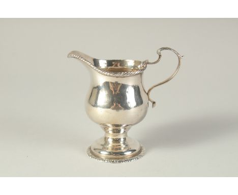 A GEORGE III CREAM JUG. London 1768.  Maker: S. M.