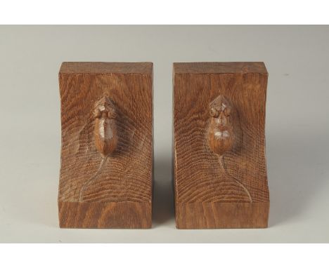 A PAIR OF MOUSEMAN OAK BOOK ENDS 6ins high, 4ins wide.