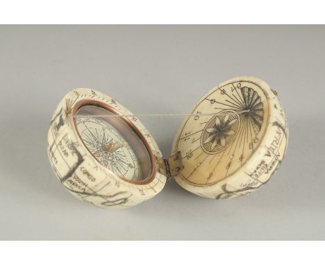 A GOOD ETCHED BONE FOLDING COMPASS AND SUNDIAL. 2.5ins diameter.