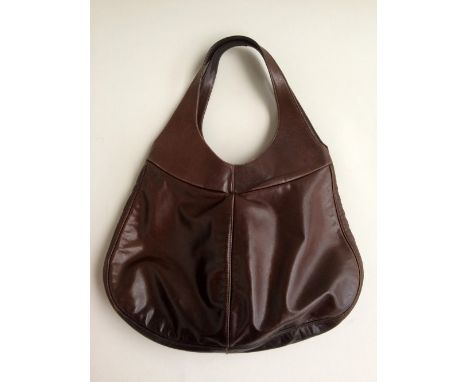 A very soft brown leather handbag by Bill Amberg, curved shape and circular hand straps.  Brown satin lining with four pocket