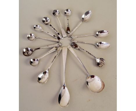 An assortment of silver teaspoons, salt spoons and mustard spoons, including a set of three teaspoons in the 'Albany' pattern