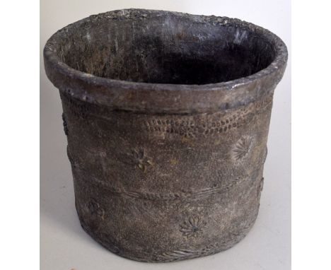 A lead planter of cylindrical form, the sides cast with wheat ears and rosettes, the base has 6 signs of the zodiac and fleur