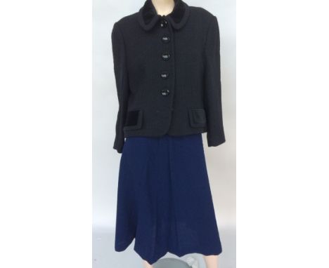 Four skirts made by a dressmaker: navy wool, calf-length with split at the back, a dirndle skirt in black and white check cot