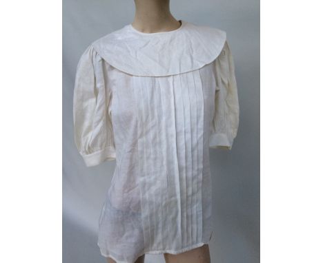 1980s white linen blouse with large ruff-like collar, puffed sleeves gathered just above the elbow and pleats to front by Cas