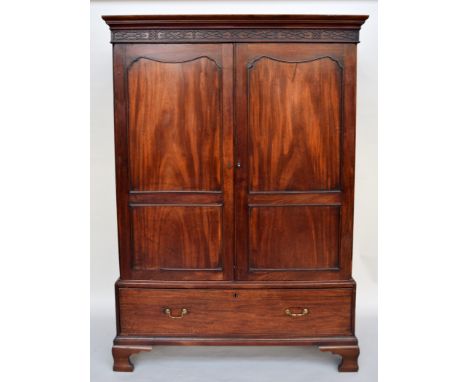 A George III mahogany linen press in the Chippendale taste, circa 1765, 58 x 125 x 191cmH