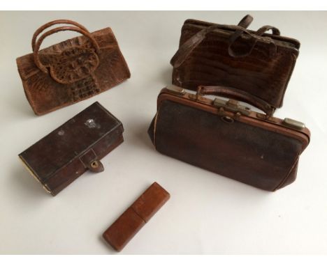 Small lacquered trunk with leather reinforcements (battered) containing three vintage handbags, one made with the dark spine 