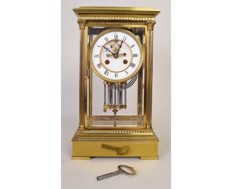A French four-glass, gilded mantel clock, the 12.5cmD cream dial with Roman numerals and gilded border over a mercury pendulu