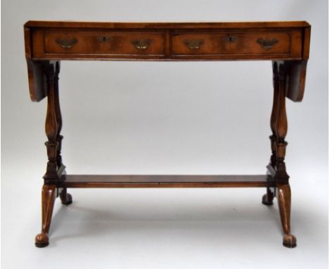 A Regency style mahogany sofa table:, with hinged top,,fitted with two short frieze drawers on ring turned column end and dua