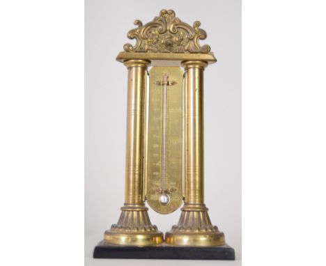 A mid 19th century Victorian brass table thermometer with foliate and column frame 21cmH