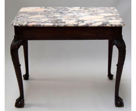 A George II style walnut side table with white and grey veined rectangular marble top above a long frieze drawer on acanthus 