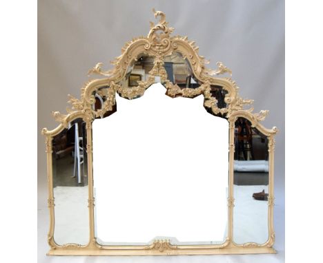 A Chippendale revival white painted over mantel mirror, the foliate carved crest with shaped bevelled panels, above a main pl