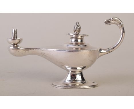 An early 20th century Asprey silver cigar lighter in the shape of an oil lamp with an eagle head finial to the handle, Birmin