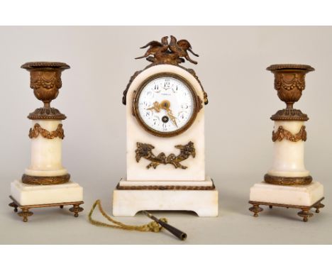 A Harrods mantle clock and key, with gilt metal decoration and ceramic dial with Arabic numerals, inscribed '678' on mechanis