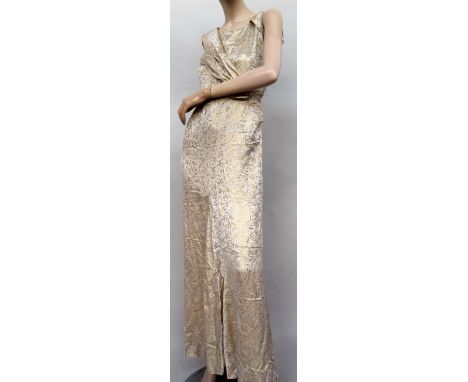 A very lovely ivory and gold silk wedding dress circa 1935 adapted for evening dress not long after, sleeveless with twist of