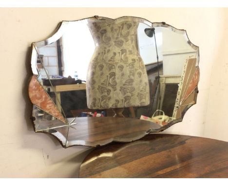 Early 20th century Art Deco mirror with cut glass and pink inlay to bevelled plate with shaped sash edges. Lightly foxed, fai