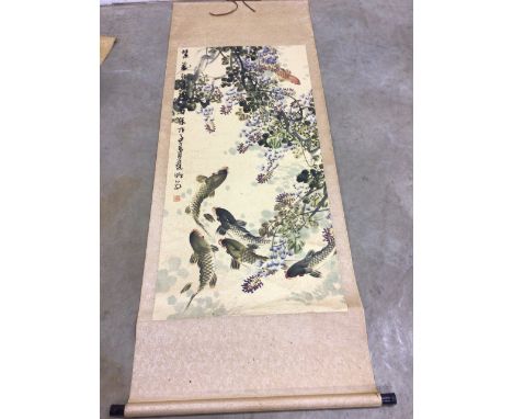 Two Chinese scroll paintings on silk; depicting a mountainous landscape with trees with inscription to top left and another d