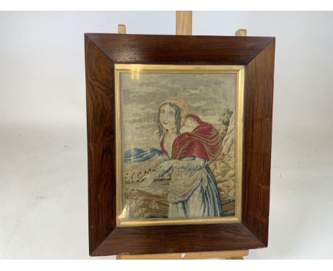 An early nineteen century needle point tapestry of a woman with baby. Verso later inscribed - The work of Ruth parry approx 1
