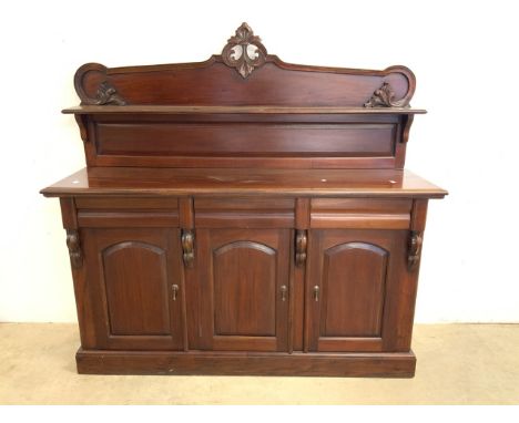 A Victorian style chiffioniere, with decorative back panel and shelf base with three drawers above cupboards. W:160cm x D:47c