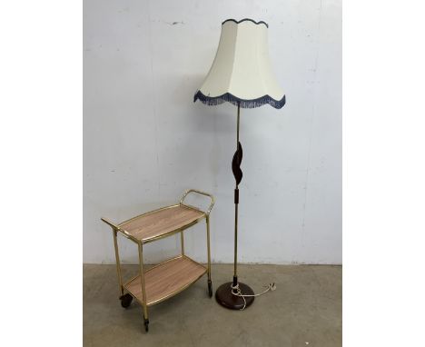 Mid century items. A metal serving trolley and a wood and metal standard lamp. Lamp untested H:146cm excluding shade