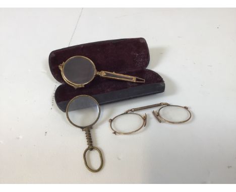 Articulated lorgnette opera glasses, with one other and a hand-held monocle. Original condition. Lorgnette replete with case.