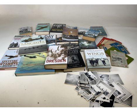 A quantity of military related books, ordnance survey maps and large quantity of photographs mixed subjects including militar