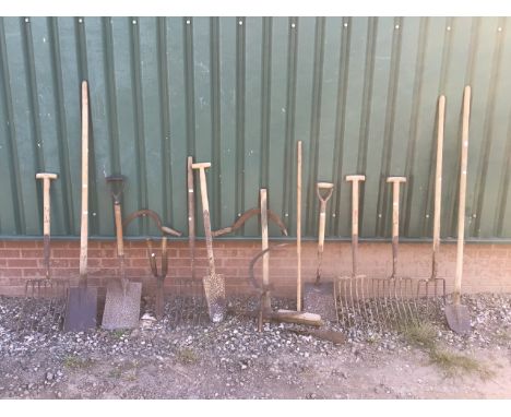 Various barn find agricultural tools including forks, spades and hand sickles. 17 total. Weathered condition, but appear usea
