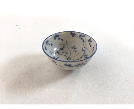 Small, 19th century Chinese ceramic bowl, handpainted in blue and white with decor in the manner of items surfaced from the T