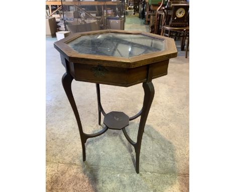 An octagonal inlaid bijouterie table with material lined interior and octagonal under shelf. W:53cm x D:53cm x H:73cm