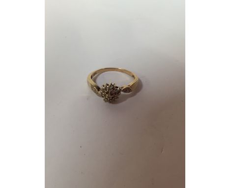 A nine carat gold diamond cluster ring. Size 9.5