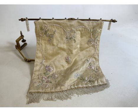 An antique folding table top gilded  fire screen with embroidered silk and bead work face cover 