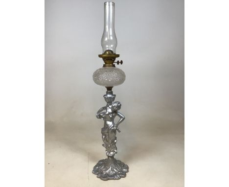 A silvered metal figural oil lamp of a lady in art nouveau styleW:17cm x H:86cm includes shade