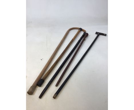 Walking stick with silver trimmed handle also with four others 