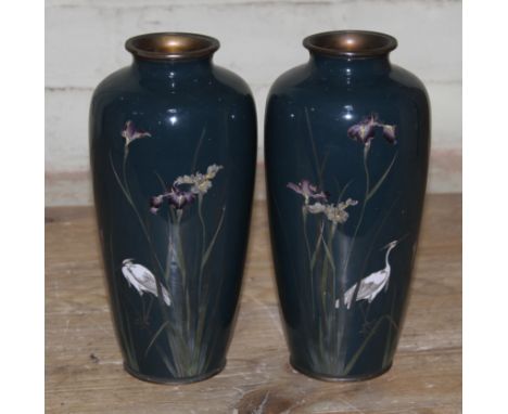 A pair of Japanese cloisonne vases, decorated with cranes amongst iris flowers, seal mark to base of each, Meiji period, heig