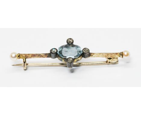 An early 20th century aquamarine, diamond and pearl brooch, the central oval cut aquamarine weighing approx. 1.32cts, surroun