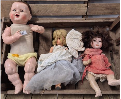 A collection of three antique dolls; German porcelain &amp; antique moveable limb doll 
