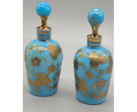 Pair of 19th century Moser blue glass scent bottles with enamel gilt decoration. Circa 1880. [9cm tall] 