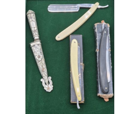 Three antique cut throat razors and Alpaca silver plated small dagger and sheath. 