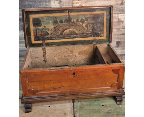19th century travel trunk; fitted with heavy wrought iron handles. Painted panel to the interior of the lid Depicting bridge,