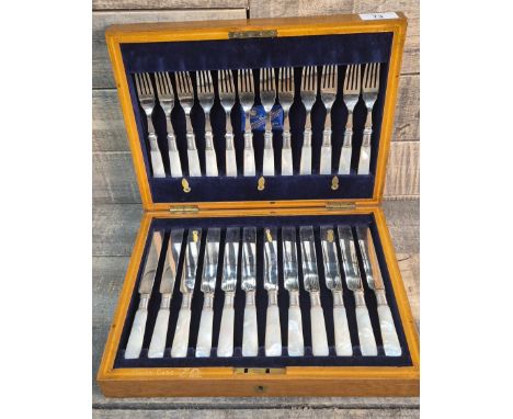 Antique oak cased fork and knife set, fitted with mother of pearl handles. Harrisons Bros &amp; Houson Sheffield