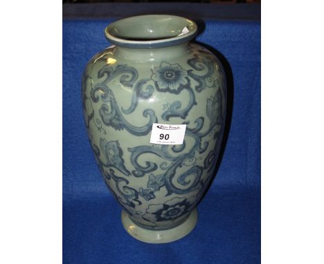 Modern Chinese porcelain vase with scroll and foliate decoration on a celadon type ground.  Unmarked.