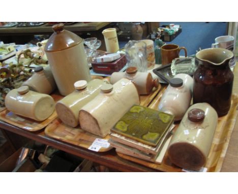 Three trays of assorted stoneware items to include: hot water bottles; jug; flagon, together with Art Nouveau style tiles. (3