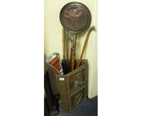 Brass relief corner stick stand together with copper warming pan, shooting stick and walking canes.