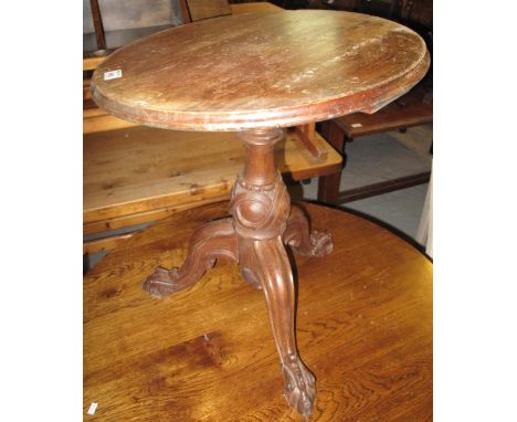 Victorian small mahogany tripod type table on carved claw feet.