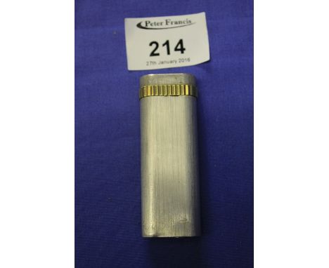Cartier white and yellow metal lighter marked Paris, Cartier to base and Aziz to lid. 